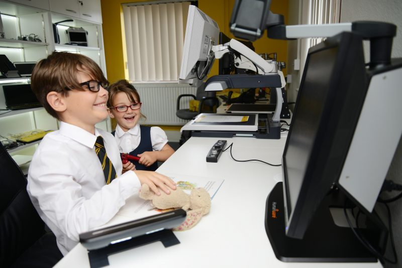 School Children Using Assistive Tech On A Computer