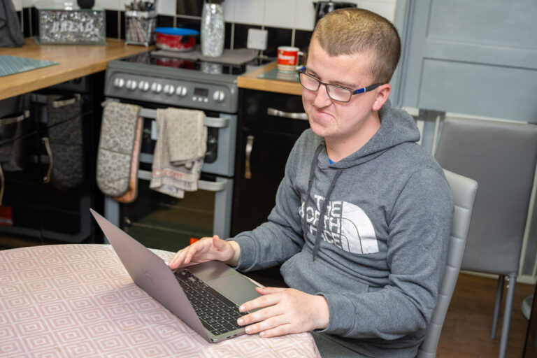 Young Man Using Laptop