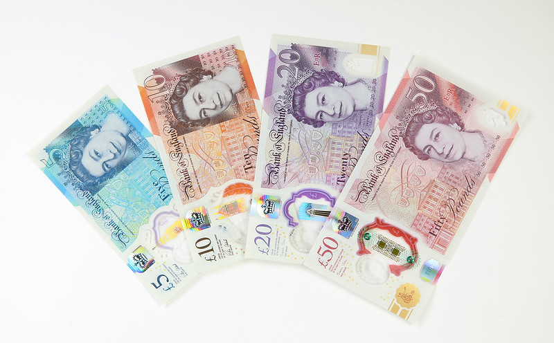 The four British bank notes spread out in a fan shape