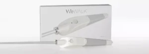 The box of a WeWALK cane showcasing the handle which is large than a traditional white cane and has a touchpad button