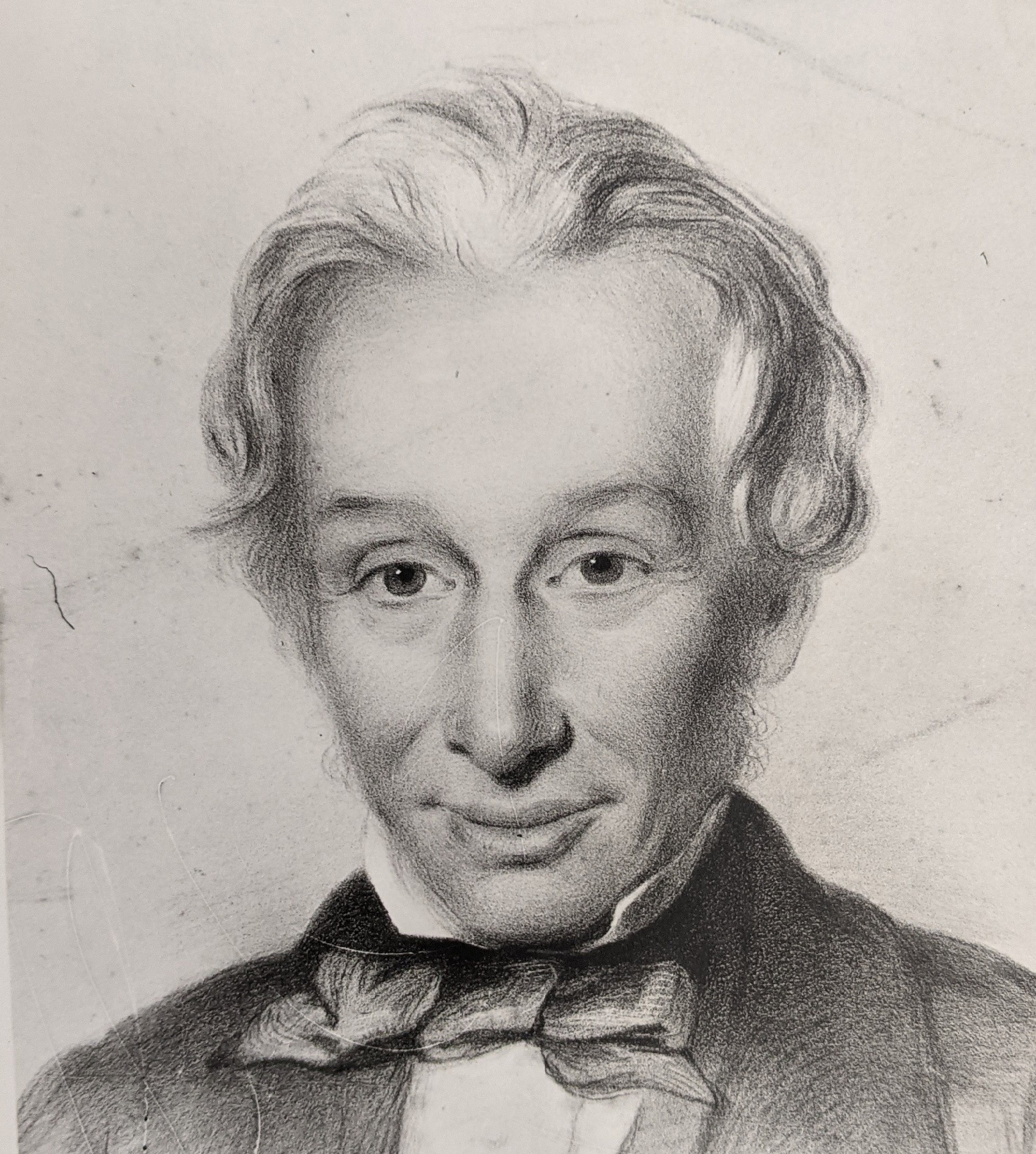 A pencil sketch of a man with white hair wearing a bow tie and jacket