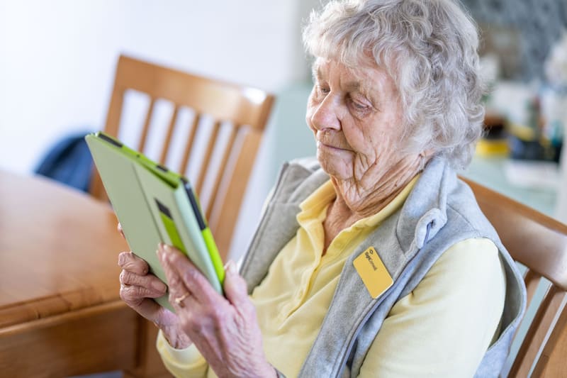 Elderly Lady Reading Book