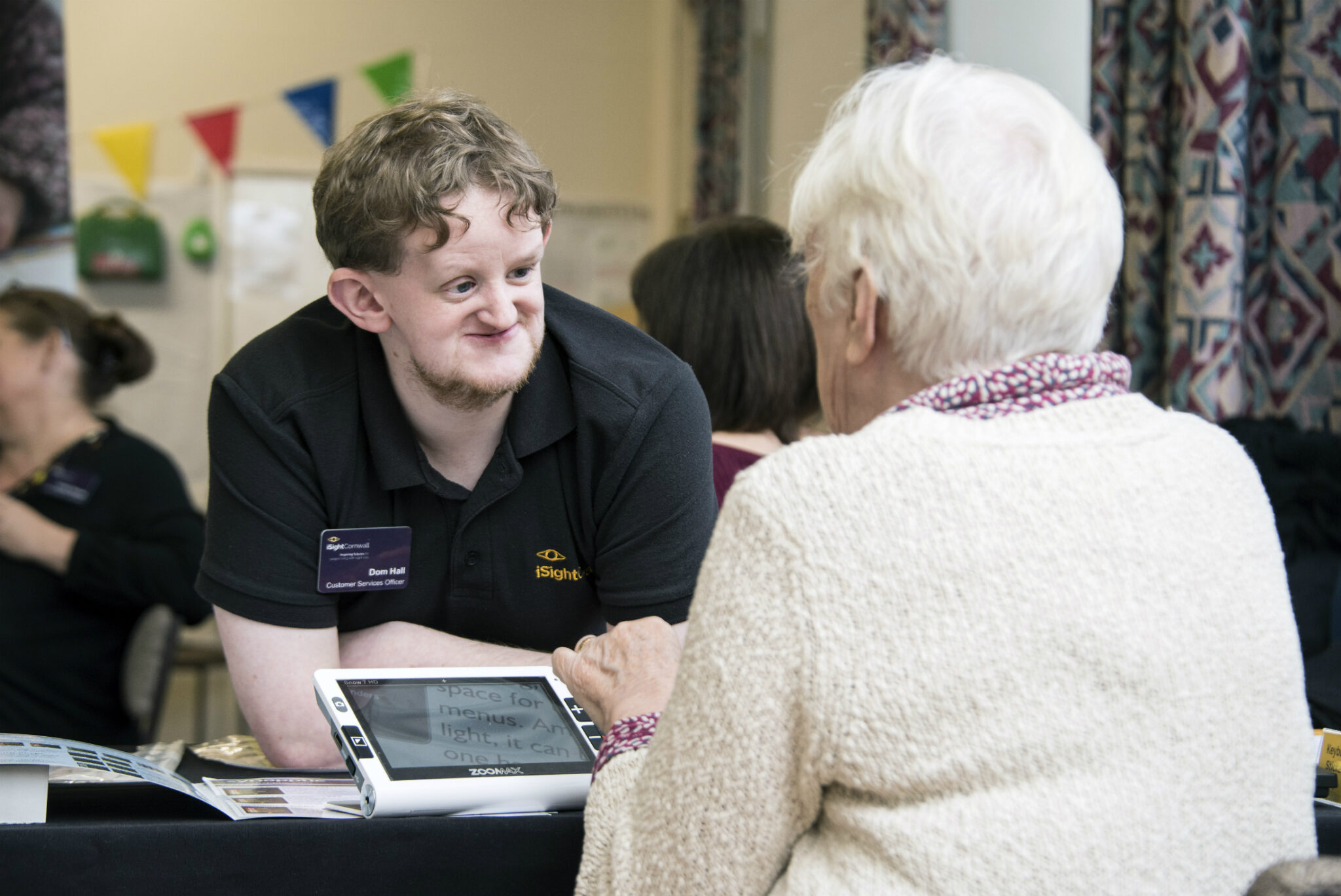 Isightcornwall’s Dominic Hall Demonstrating Daily Living Equipment At An Event