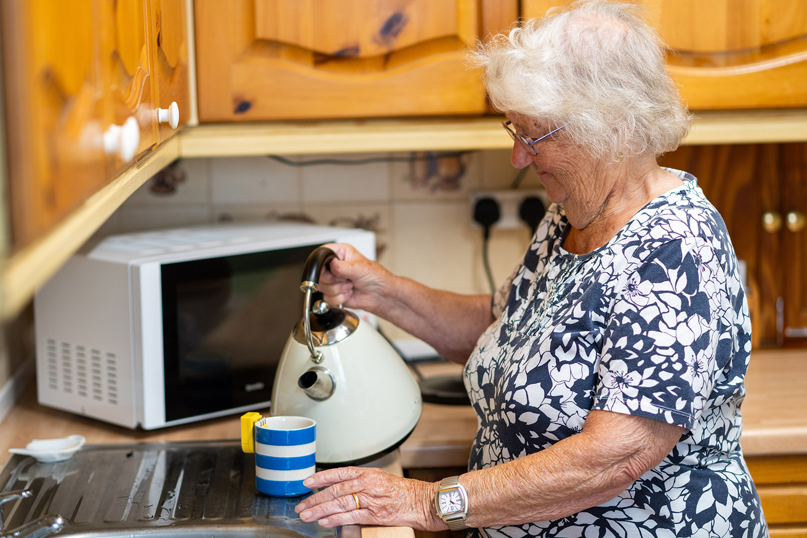 Woman Using Kettle