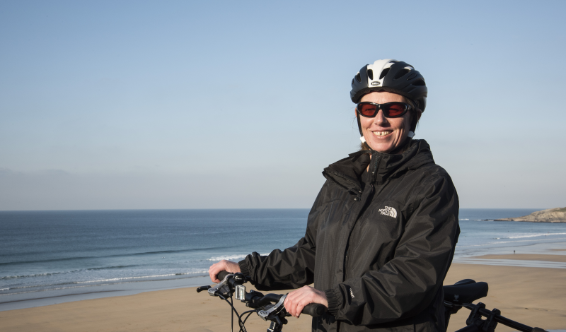 Lady On Bike With Beach Background