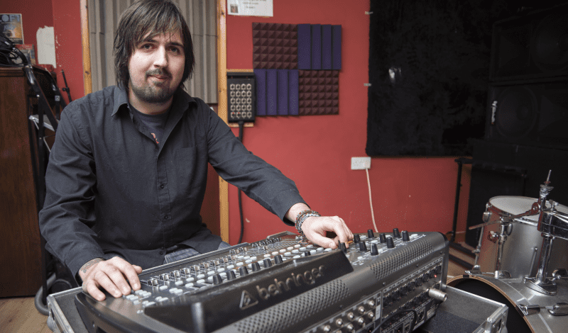 Man Wearing Black Shirt Using Sound Mixer