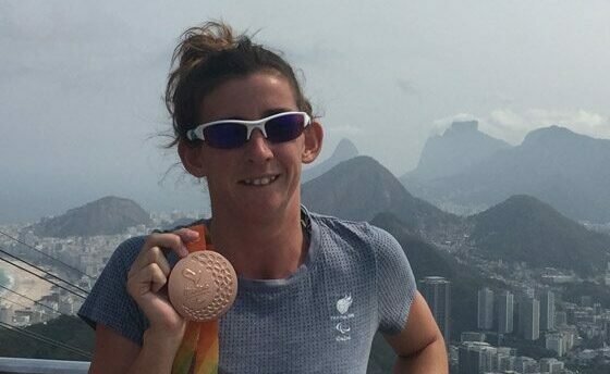 Melissa Reid Standing With Paralympic Medal