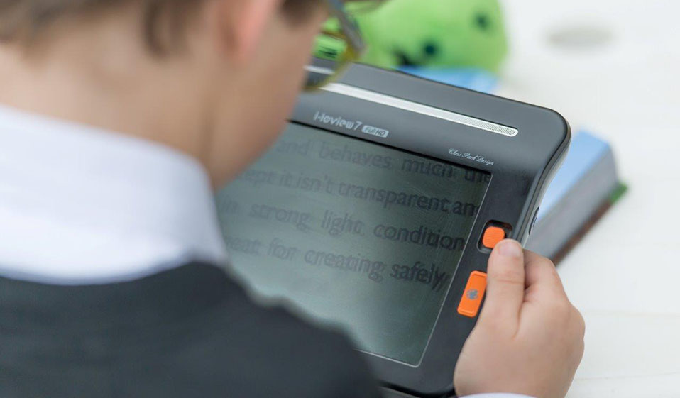 Student In Black Jumper Using Video Magnifier