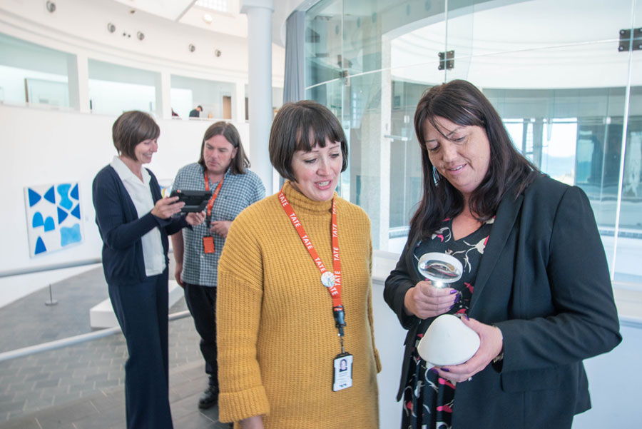 Two Women Talking Through How To Use Magnifier